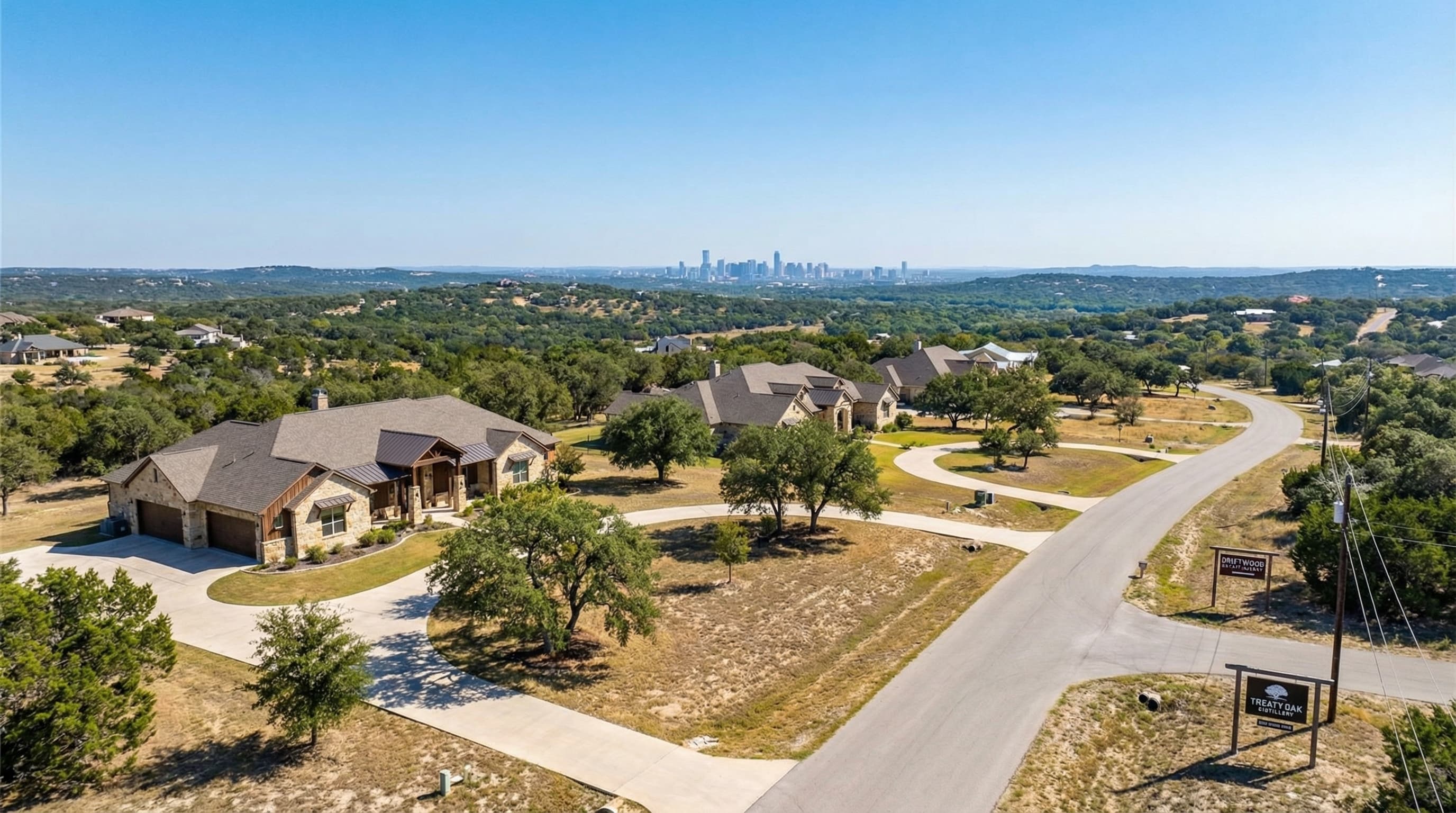 Dripping Springs Texas Hill Country estate with Texas winery views and live oak trees
