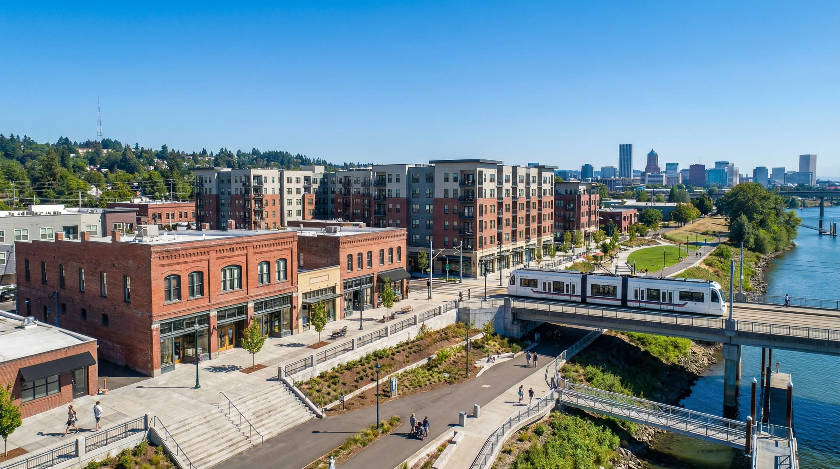Milwaukie Oregon downtown with Willamette River, Orange Line MAX, and tree-lined neighborhoods